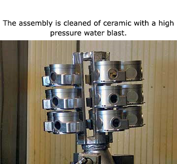 The assembly is cleaned of ceramic with a high pressure water blast